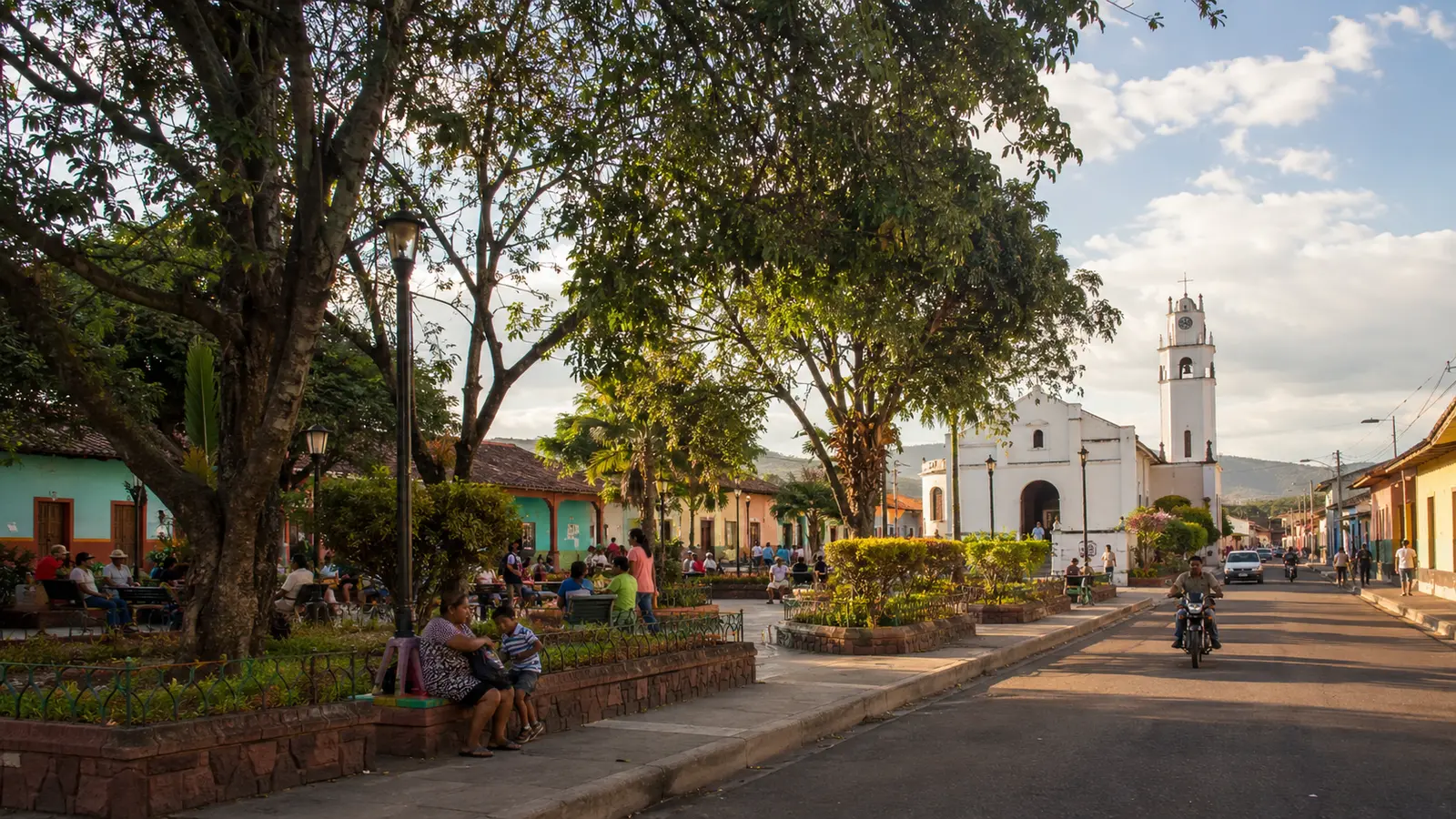 A shaded public square and everyday street life in Somoto